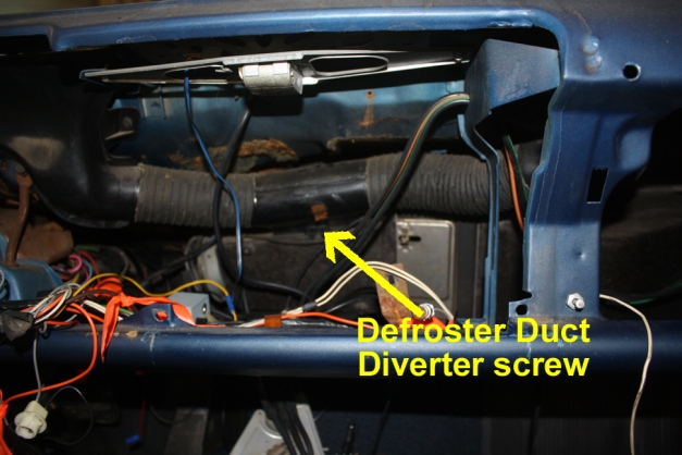 Location of the defroster duct diverter screw.